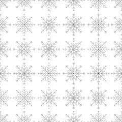 A seamless black and white snowflake pattern illustration, perfect for winter and Christmas themed designs. Wrapping paper. This design is not AI generated.