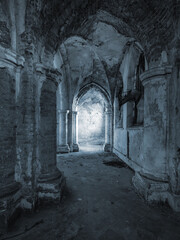 view to light on the wall through columns in abandoned cathedral in vintage style
