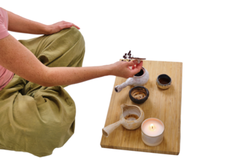 Woman hold a Chinese tea ceremony with a teapot, isolated on a white background