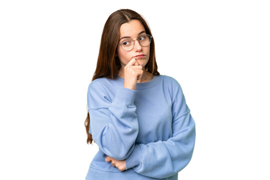 Teenager girl over isolated chroma key background having doubts and thinking