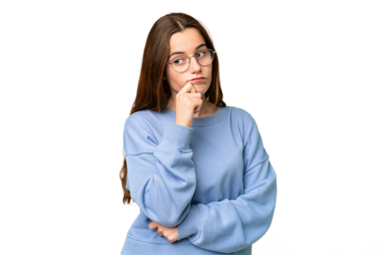 Teenager girl over isolated chroma key background having doubts and thinking