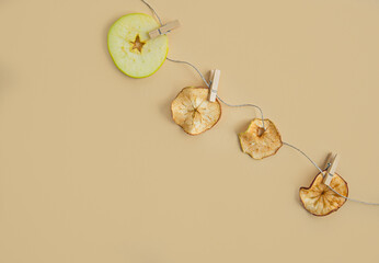 Dried pear slices on a light background. View from above.