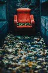 old red armchair in an abandoned place 