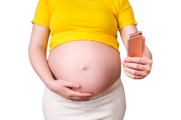 A pregnant woman looks at the phone screen, isolated on a white background