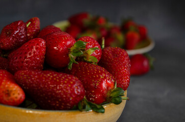 strawberries in fresh fruit close-up with gray background
