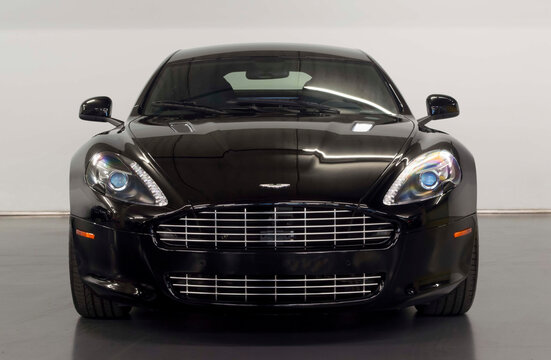 Black Aston Martin Rapide front view, isolated on white background - High Resolution Image