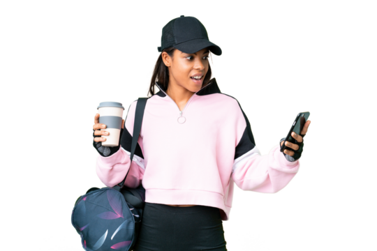 Young sport African American woman with sport bag over isolated chroma key background holding coffee to take away and a mobile