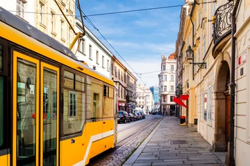 Foto op Plexiglas anti-reflex Narrow street with tram near the cathedral in Pilsen, Czech Republic © EKH-Pictures