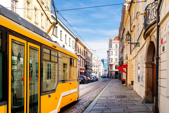 Narrow street with tram near the cathedral in Pilsen, Czech Republic