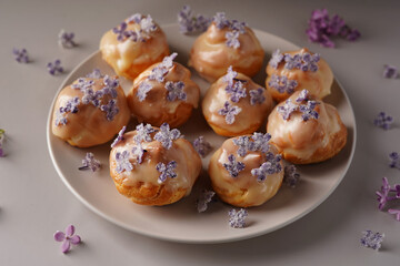 dessert, eclairs, éclair, shu decorated with lilacs in sugar, light background, minimalism, no people