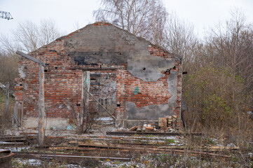 A dilapidated brick building on the territory of a military base