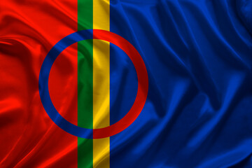 beautiful colored national flag of lapland on textured fabric, concept of tourism, emigration, economy and politics, closeup - obrazy, fototapety, plakaty