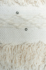 Off-white, woven textile background.