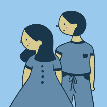 A couple (a man and a woman) is wearing a matching blue outfit on a light blue background