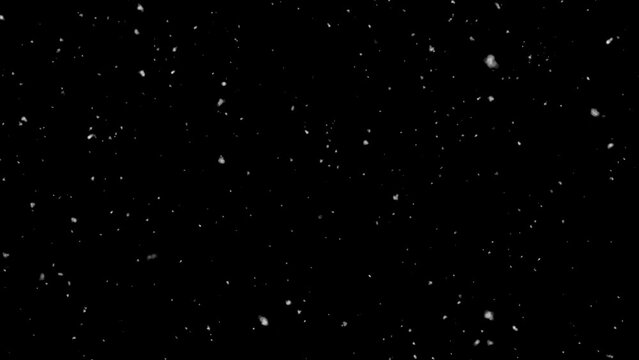 Isolated snow falling on black background