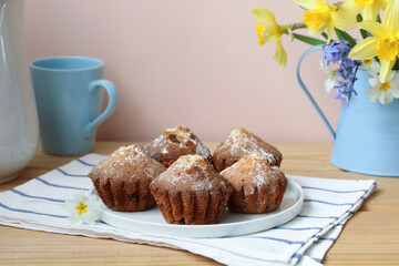 still-life, bouquet with daffodils, garden flowers. spring, rural composition, cottage core. cupcakes.