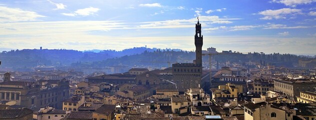 Aerial view of the city of Florence with the tower of Palazzo Vecchio, the seat of the municipality of Florence, in the center