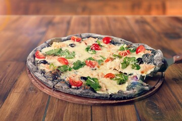 Delicious fresh pizza with mozzarella and vegetables