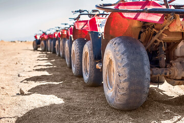 Red quads stand in a row on the shore of the Red Sea. Dahab, Egypt. © Natallia
