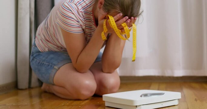 Libra and depressed, frustrated and sad woman crying while sitting on the floor