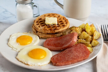 spam with fried eggs homefries and waffles