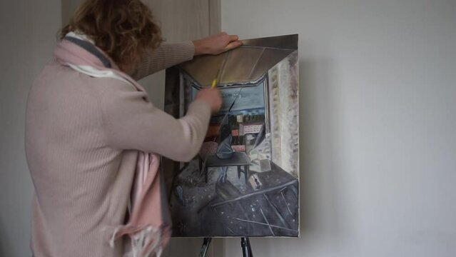 the artist tore his painting the artist is nervous