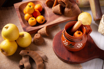 Mexican Ponche. Christmas fruit punch is a hot fruit-infused drink, traditionally consumed in the winter season during posadas and Christmas Eve. Made with sugar cane, piloncillo and fruits.