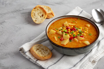 Homemade Corn Chowder in a Bowl, side view. Copy space.