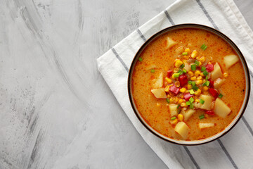 Homemade Corn Chowder in a Bowl, top view. Flat lay, overhead, from above. Space for text.