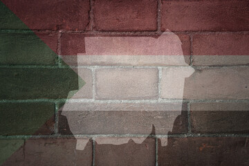 map and flag of sudan on a old brick wall