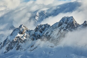 Winter high mountains in clouds