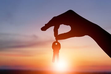Businessman holding small key model.