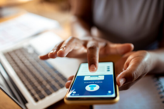 Close up cropped shot of unrecognizable woman using smartphone bank app - Powered by Adobe