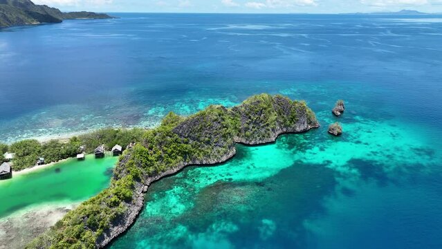 Idyllic Rufas Island, near Penemu in Raja Ampat, is surrounded by healthy corals and open ocean. This island, as well as those in the region, support some of the highest marine biodiversity on Earth.