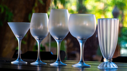Variety of crystal glasses for different types of drinks: wines, juices and drinks