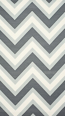 A pattern of grey and white chevron stripes running diagonally