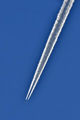 Two engines exhaust turning into ice crystals at 35,000 feet form a category of contrail called “Persistent Spreading” 