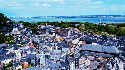Drone panorama of Honfleur town with lghthouse on entrance of bay , Seine river and Rouen cove