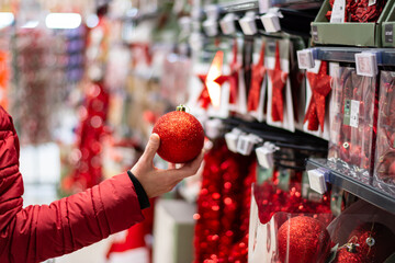 Christmas theme shopping. Woman choosing new year things for her apartment