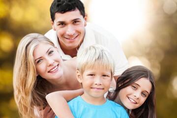 Happy young parents with children outdoor