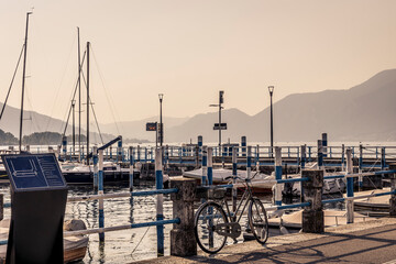 View of the pier in the town of Iseo, on Lake Iseo, Italy, in the late afternoon - 681237509
