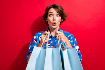 Photo of shopaholic amazed young girl open unpacking receive gift bags good bargain pouted lips...
