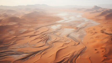 Vast desert landscape with dune patterns, bird's-eye view - obrazy, fototapety, plakaty