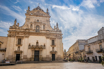 Obraz premium Galatina, Lecce, Puglia, Italy. Ancient village in Salento. The wonderful Church of Saints Peter and Paul, in baroque style. Many marble statues and sculptures adorn the facade of the church.