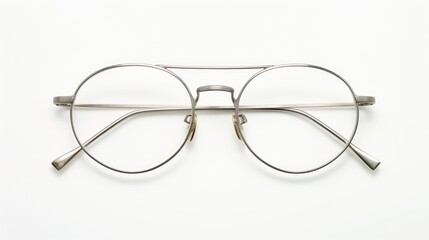 Metal glasses, prescription or reading, on clean white backdrop.