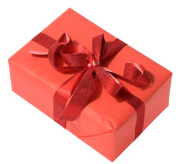 Box is wrapped in red gift wrapping and red ribbon on a white isolated background