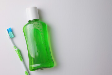 A mouthwash on a colored background. Dental care, dental health.