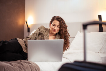 Woman working in hotel room