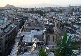 Rooftop View of Athens Greece Cityscape with Distant Acropolis and Mountains