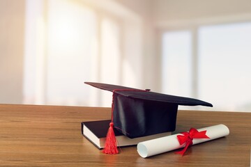 Graduation mortarboard and  stack of books. Education concept.